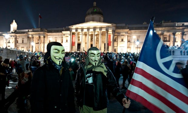 Million Mask March protesters in Trafalgar Square, London