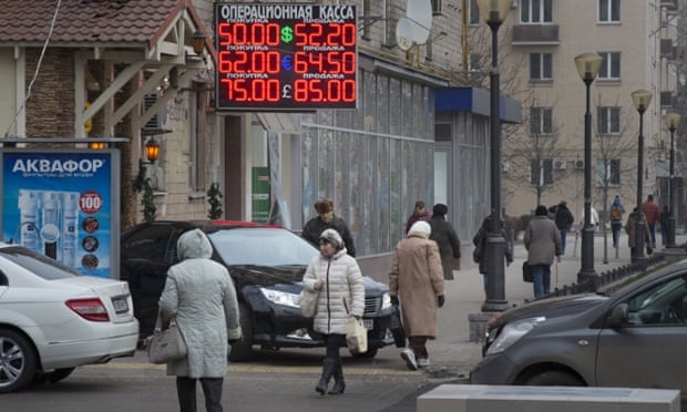 Ruble tumbles after oil hits five-year low, before recovering.