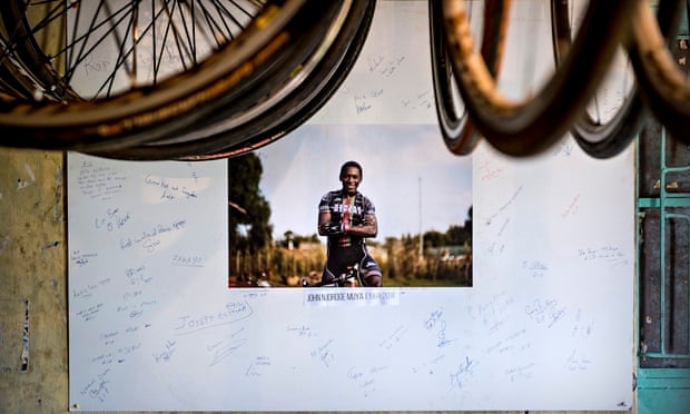 The Kenyan Riders have made a tribute to their team leader John Njoroge, who died in an accident in August. Photograph: Sven Torfinn/for the Guardian . 