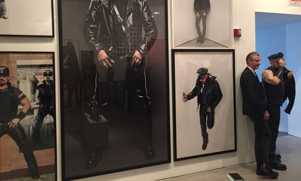 Curator Jrme Sans posing next to wax Peter Marino