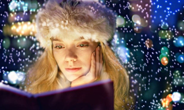 woman reading winter lights