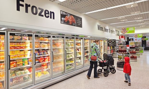 Shoppers in a supermarket frozen food aisle