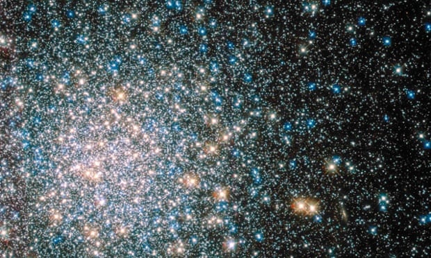 A globular star cluster called Messier 5 containing 100,000 or more stars packed into a region around 165 light-years across. 
