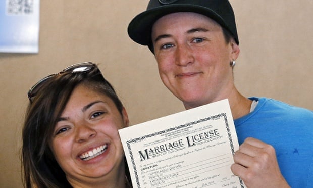 Victoria Quintana and Samantha Getman show their marriage licence at the Denver clerk&#39;s office. Photograph: Ed Andrieski/AP - ee6412c8-49c0-4c1a-b6a2-bdee98ca4c0b-620x372