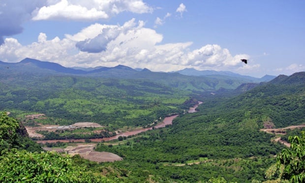 A far-away view of the controversial Gibe III dam under construction in Ethiopia   s Omo valley and surrounding hills, May 2012. The government says the Gibe III dam will boost development, give access to power for many Ethiopians -- about half of the population -- currently living without it.  But critics say Ethiopia must also consider the environmental and social impact it will have on some 500,000 people living downstream and at Lake Turkana in neighbouring Kenya, who rely on the river for their livelihood.