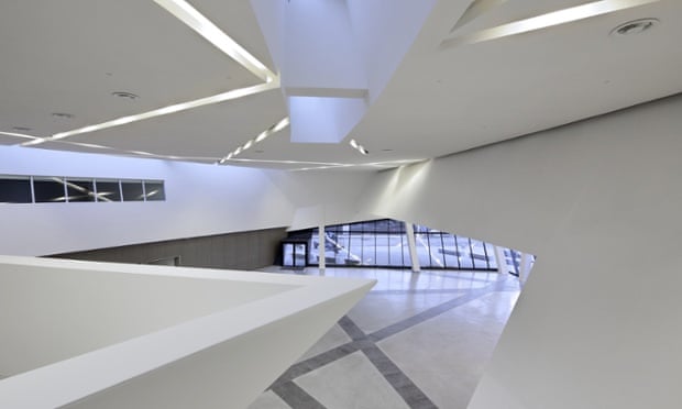 The interior of Libeskind's conference centre is punctuated by slanting staircases and criss-crossing lighting tracks.