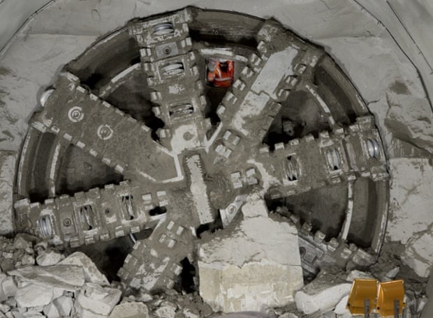 A workman is seen through a drill after the Crossrail breakthrough into the east end of Crossrail's Liverpool Street station in London.