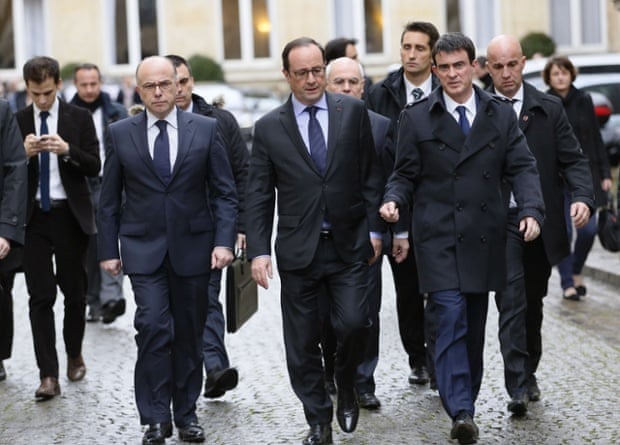 French President Francois Hollande leaves the Interior Ministry in Paris