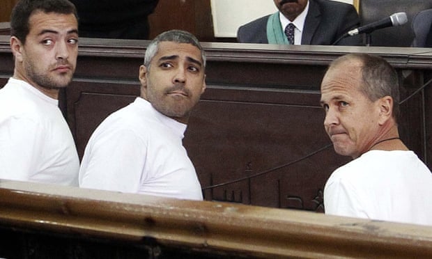 Baher Mohamed, Mohammed Fahmy and Peter Greste at their trial in 2014.