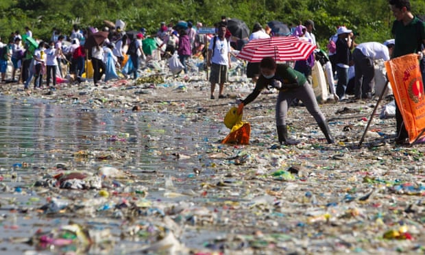 Filipino volunteers pick rubbish during the 29th International Coastal Cleanup at the shore of the 'Long island' in Paranaque city, south of Manila. A new study indicates that the plastic problem might be bigger than we ever thought.
