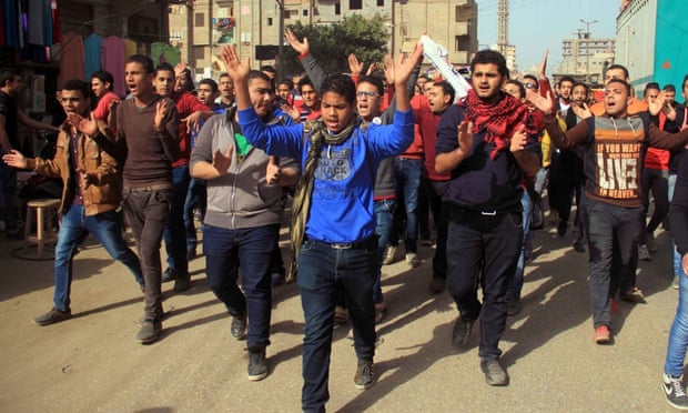 Mourners and relatives of a man killed during the clashes in Cairo at Zamalek's match with ENPPI.