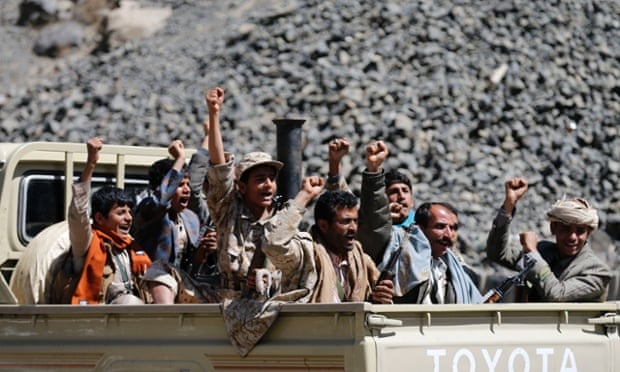 Houthi rebels ride in a truck in Sana'a.