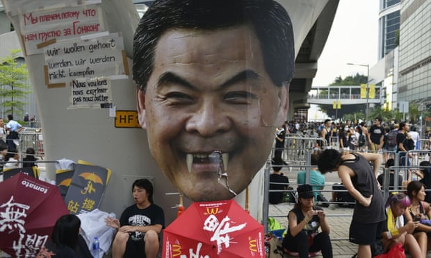 Leung Chun-ying, with added fangs, looms over a Hong Kong pro-democracy protest site