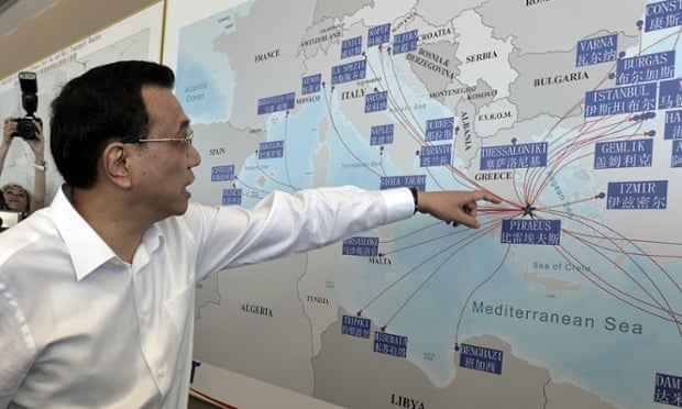 The Chinese premier, Li Keqiang, looks at a shipping routes map at the port of Piraeus, where Chinese shipping giant Cosco controls two of the three container terminals, on a visit last year.