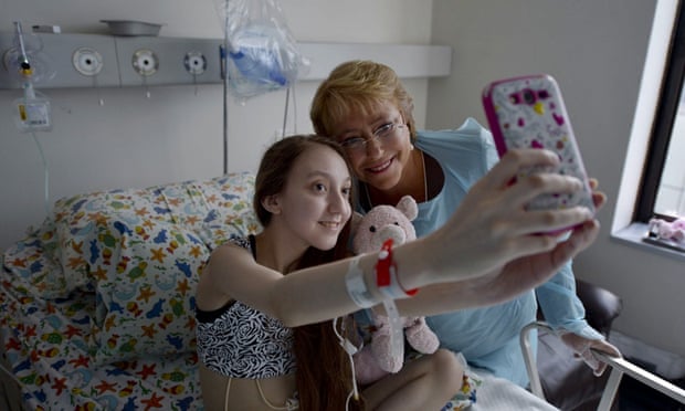 Michelle Bachelet, right, poses for a selfie with Valentina Maureira on Saturday.