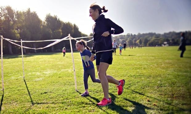 Kate Carter and her daughter on a 2km fun run at Wimbledon park.