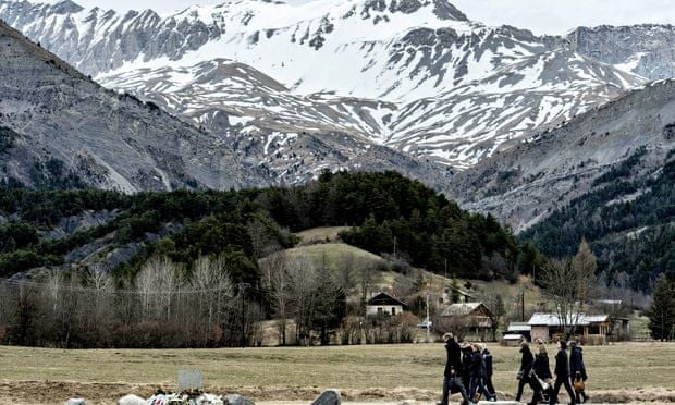 People arrive to pay tribute to the victims of the Germanwings flight that crashed in the French Alp