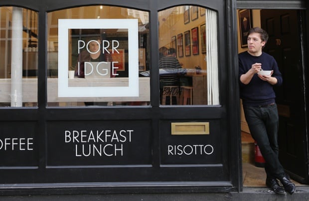Cafe owner Nik Williamson eats a bowl of porridge at the 'Porridge Cafe' in Shoreditch on March 2, 2015 in London, England. The Porridge Cafe is the first of its kind to open in London.  (Photo by Dan Kitwood/Getty Images)Human InterestBusinessFinanceRetail