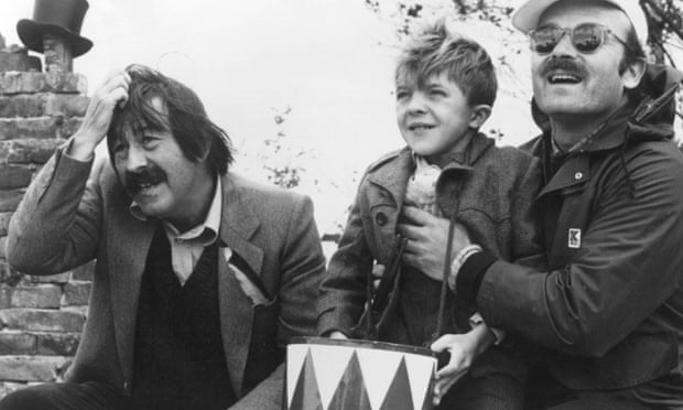Günter Grass, left, with actor David Bennent as Oskar Matzerath and director Volker Schlöndorff on the set of the film version of The Tin Drum, based on Grass's novel.