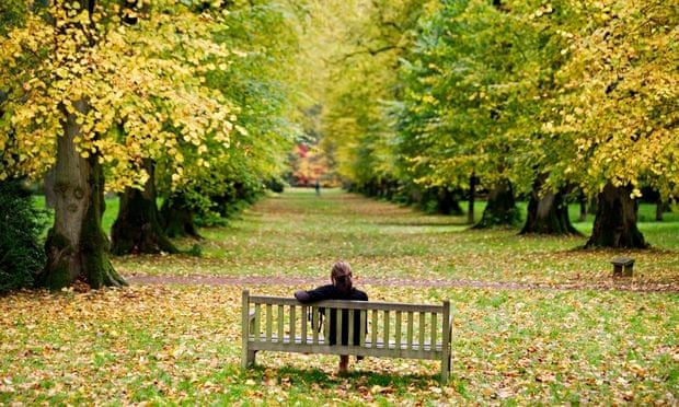 Woman sitting alone on a  007 - How to Embrace loneliness :  A  Modern Guide