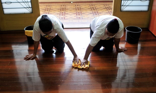 Filipino women hoping to work abroad as housekeepers undertake a training course in Manila.