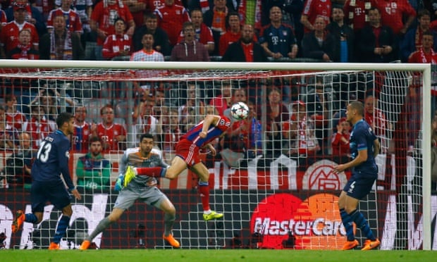 Bayern Munich's Robert Lewandowski scores their third goal.