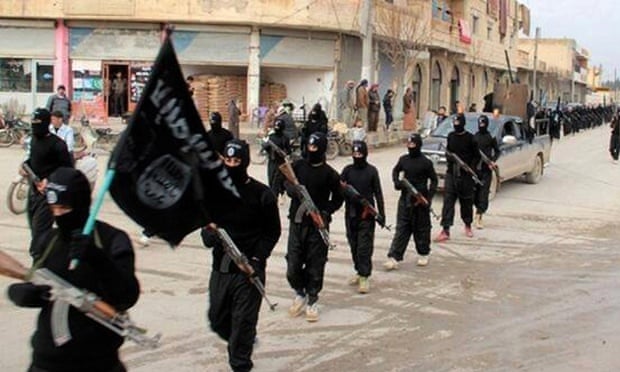 Isis fighters marching in Raqqa, Syria.