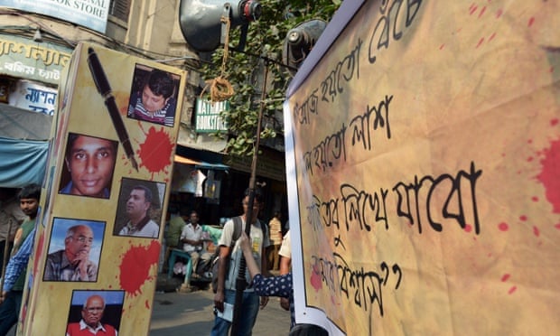 A  poster with pictures of the murdered Bangladeshi bloggers at a demonstration in Kolkata, India, on May 16.