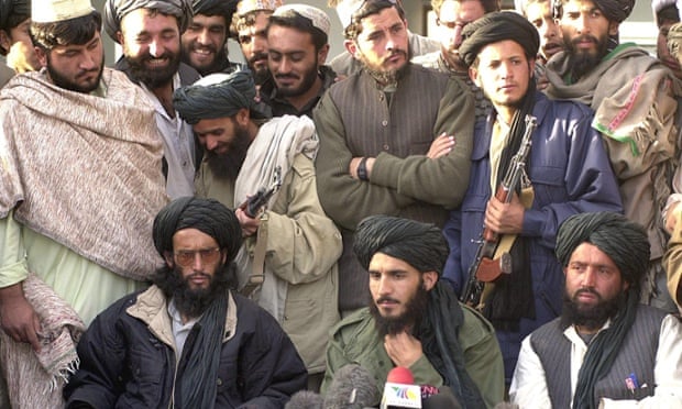 Mohammad Tayyab Agha, seated in the center, led an official delegation to Tehran this week. In this file photo, the special assistant to Mulla Mohammad Omar, addresses a press conference in Spin Boldak on 21 November 2001.
