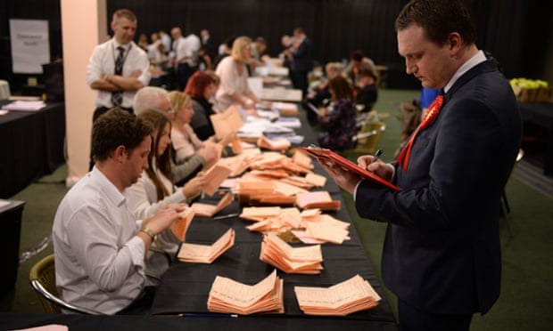 Labour party officials monitor the count at the counting centre at Doncaster racecourse.