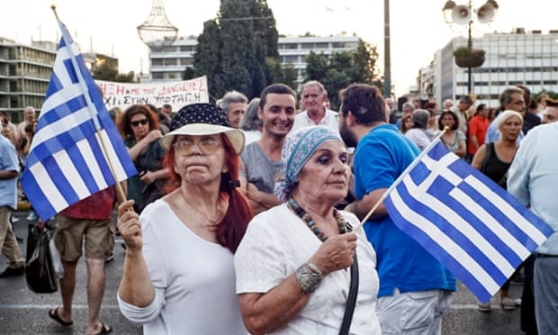 The strain shows on one protester’s face at a pro-government rally in front of the Greek parliament in Athens as hopes fade of a breakthrough.