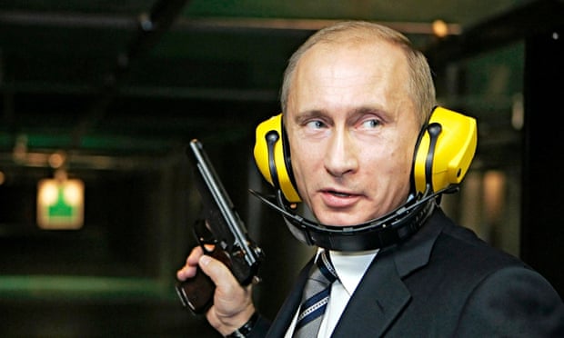 Hear no evil:  Russian president Vladimir Putin tries his hand at a Moscow shooting gallery. 