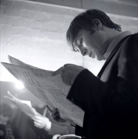 Jane Bown and The Beatles: John Lennon of The Beatles reading a newspaper