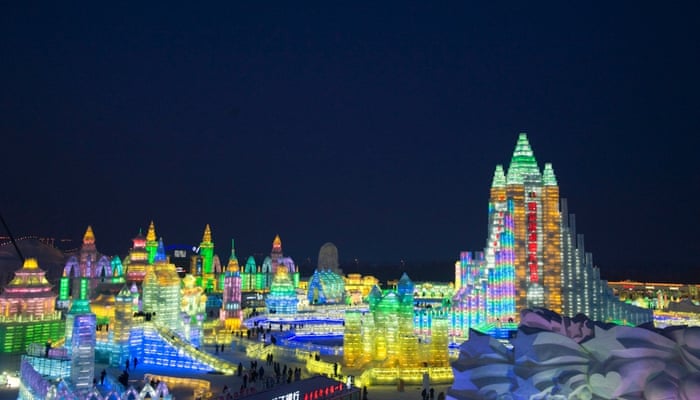 A general view of large ice sculptures at the 15th Harbin Ice and Snow World which shows the lighting scene at Sun Island, in Harbin city, Heilongjiang province, northern China