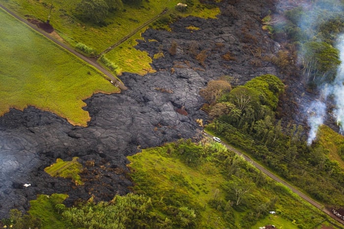Lava from the Kilauea volcano in Hawaii flows towards homes in the town of Pahoa where close to 1,000 people live.