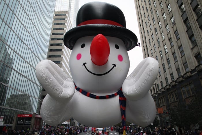 New York, US A snowman balloon make its way down JFK Boulevard during the 95th annual Thanksgiving Day Parade