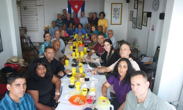 Group of Cuban dissidents hold meeting in office of 14ymedio, the online newspaper of blogger Yoani Sanchez (fourth from right) in Havana on 22 December in this unverified handout photo.<br> 