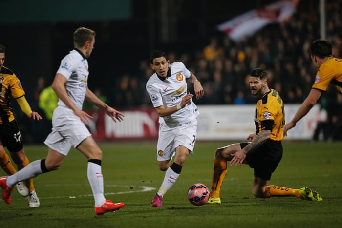 The match starts and Dí Maria tries to break through the Cambridge United defence