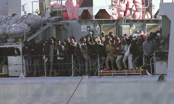 Migrants aboard an Italian navy vessel approaching the Italian port of Messina on Saturday.