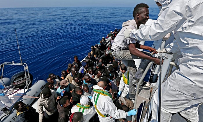 Migrants being rescued by an Italian ship