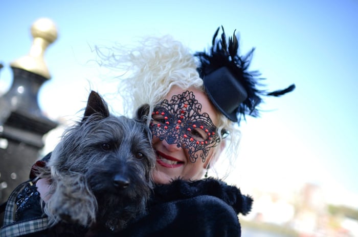 A goth poses for a photograph with her dog in Whitby, North Yorkshire.