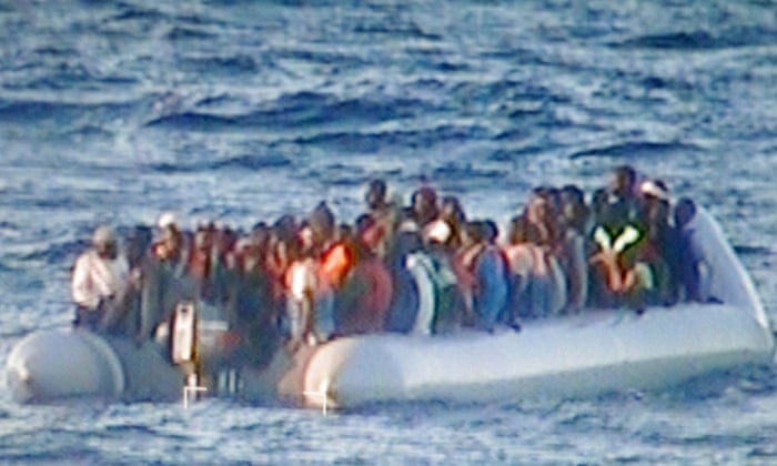 An Italian naval vessel carries people rescued in the Mediterranean in December