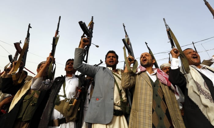 Armed Houthi supporters protest against airstrikes carried out by a Saudi-led coalition in Sana'a, Yemen.