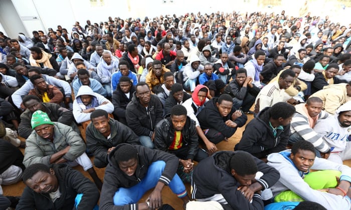 Refugees from Sub-Saharan Africa gather at a centre for illegal migrants in the city of Misrata in northern Libya. The country has been a launchpad for many trying to reach Europe, who turn to people smugglers to cross the Mediterranean.