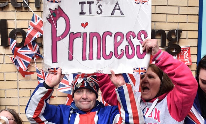 Royal fans celebrate the birth of Kate and William’s daughter, outside St Mary’s hospital in London.