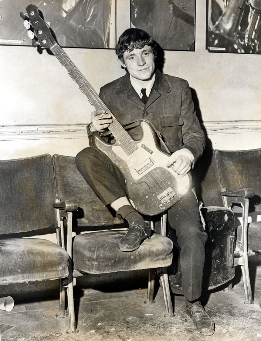 A young Jack Bruce with a bass guitar