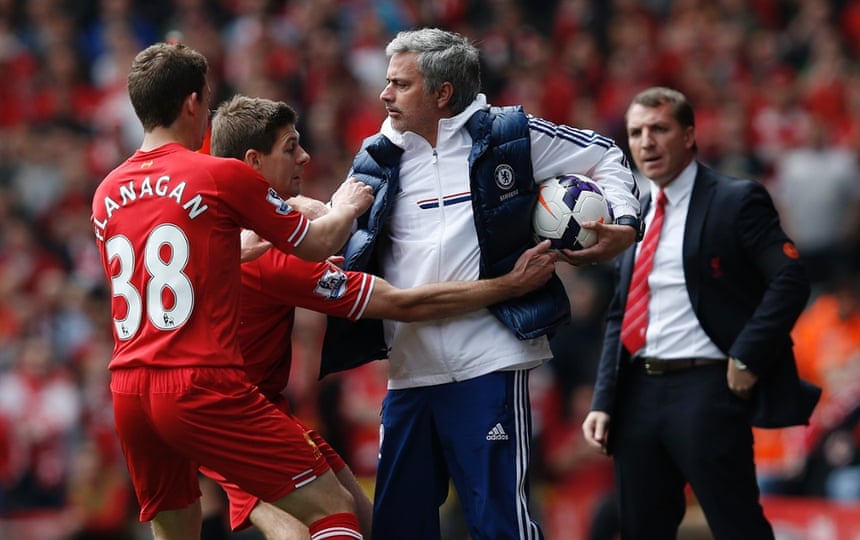 27 April: Jose Mourinho keeps the ball despite the efforts of Steven Gerrard during the Premier League match between Liverpool and Chelsea which handed momentum in the title race back to Manchester City