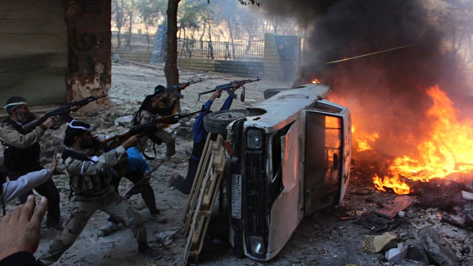 Free Syrian Army fighters fire at forces loyal to Bashar al-Assad in Aleppo
