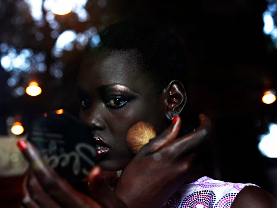 A South Sudanese model applies make-up during the Festival of Fashion and Arts for Peace in Juba. Andreea Campeanu/Reuters - A-South-Sudanese-model-ap-016