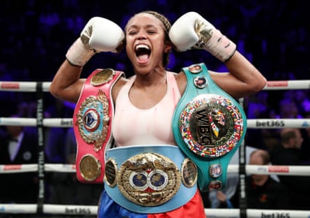 Natasha Jonas celebrates with the WBC, WBO, IBF super-welterweight belts after her victory over Marie-Eve Dicaire in November 2022